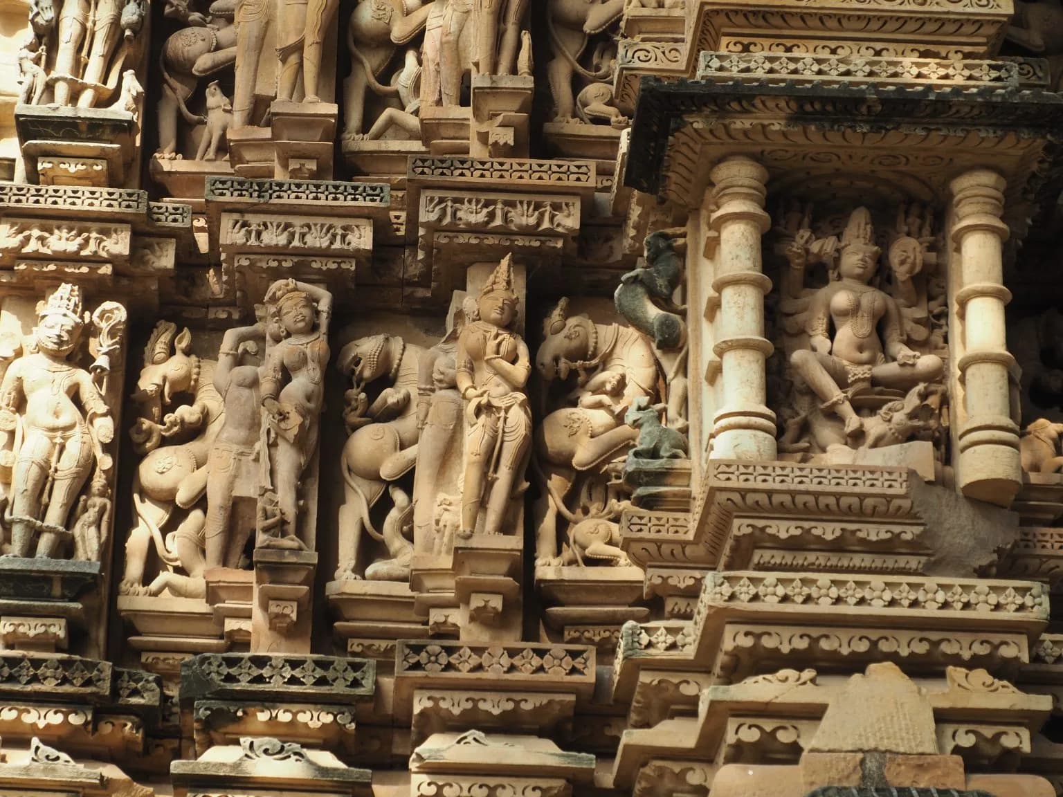 Detailed stone carvings on a temple at Khajuraho