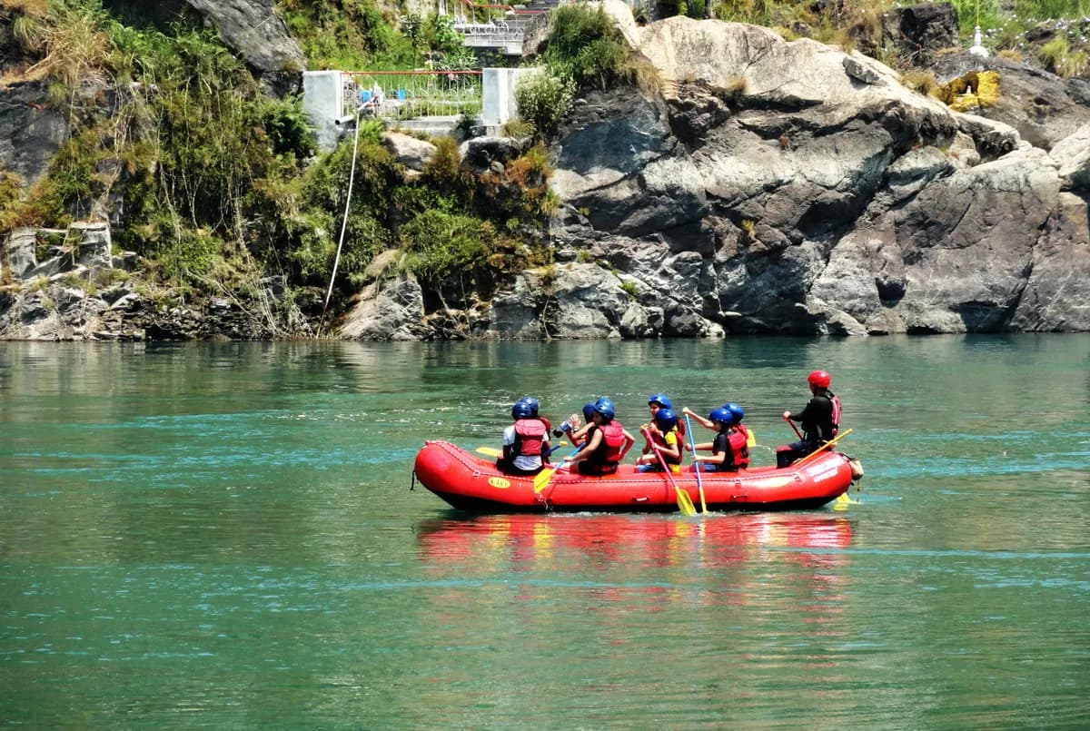 A rafting group navigating rapids on the Ganges near Rishikesh